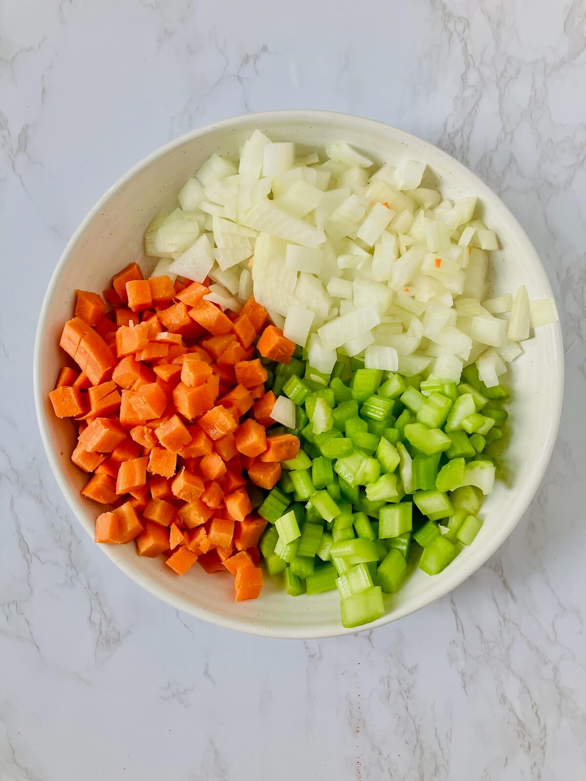 chopped carrot celery and onion in a bowl