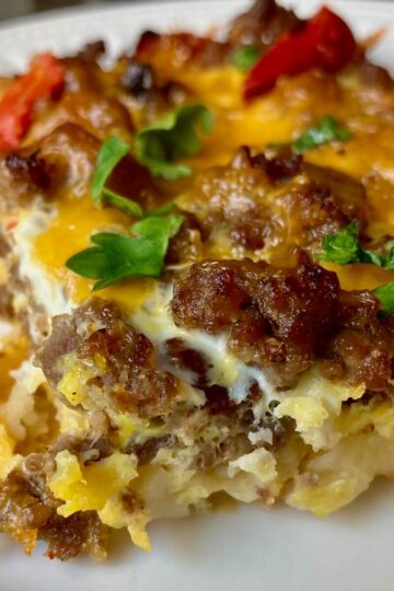 a slice of breakfast casserole on a white plate