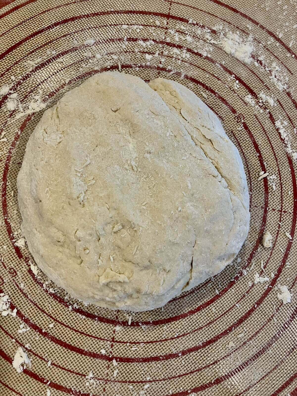 chicken and dumpling dough on a rolling mat