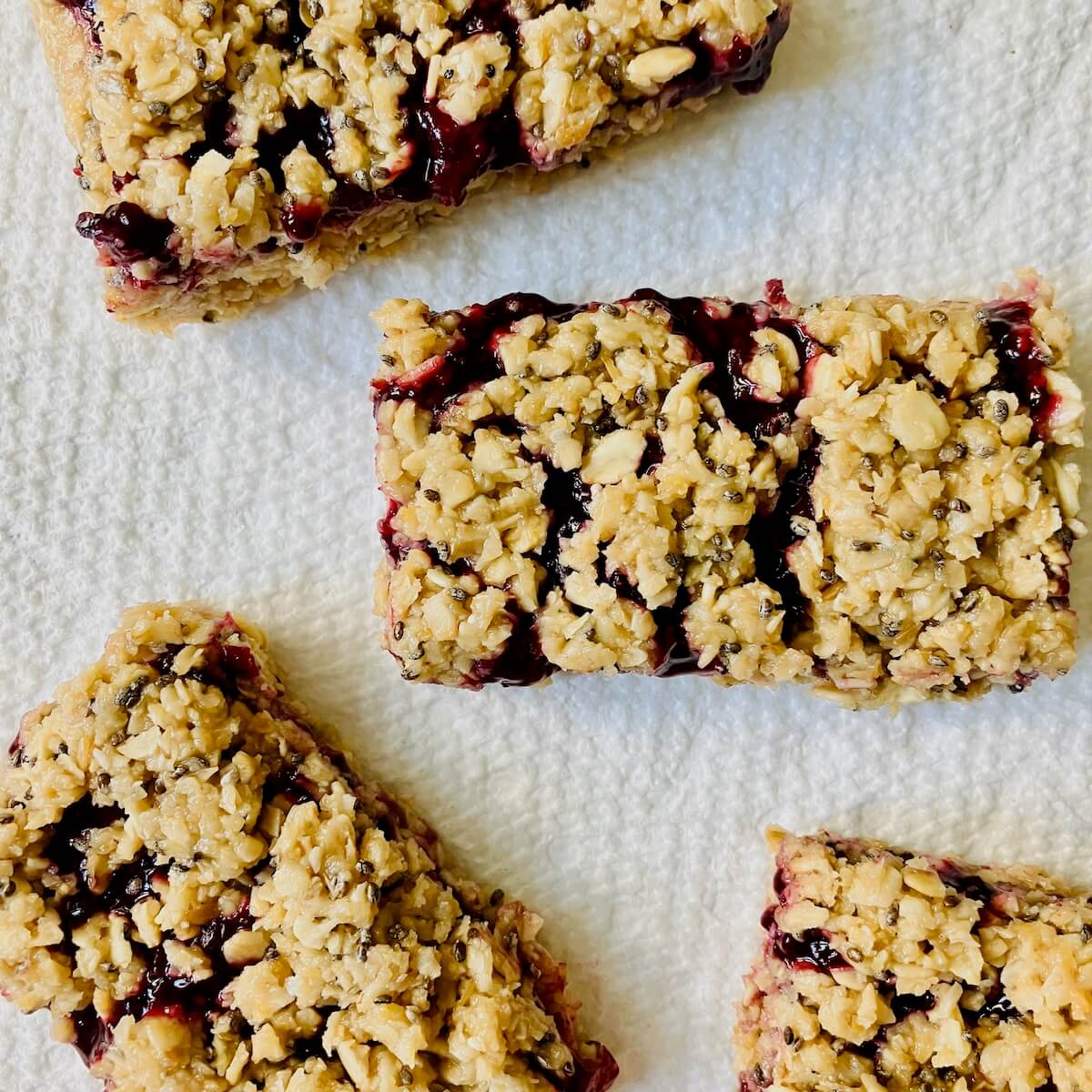 four berry bars on a white background